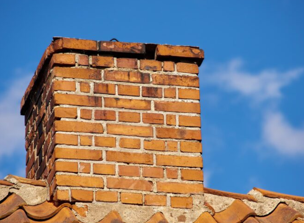 Top 5 Signs Your Chimney Needs Cleaning in Plano 1 peeling brick chimney